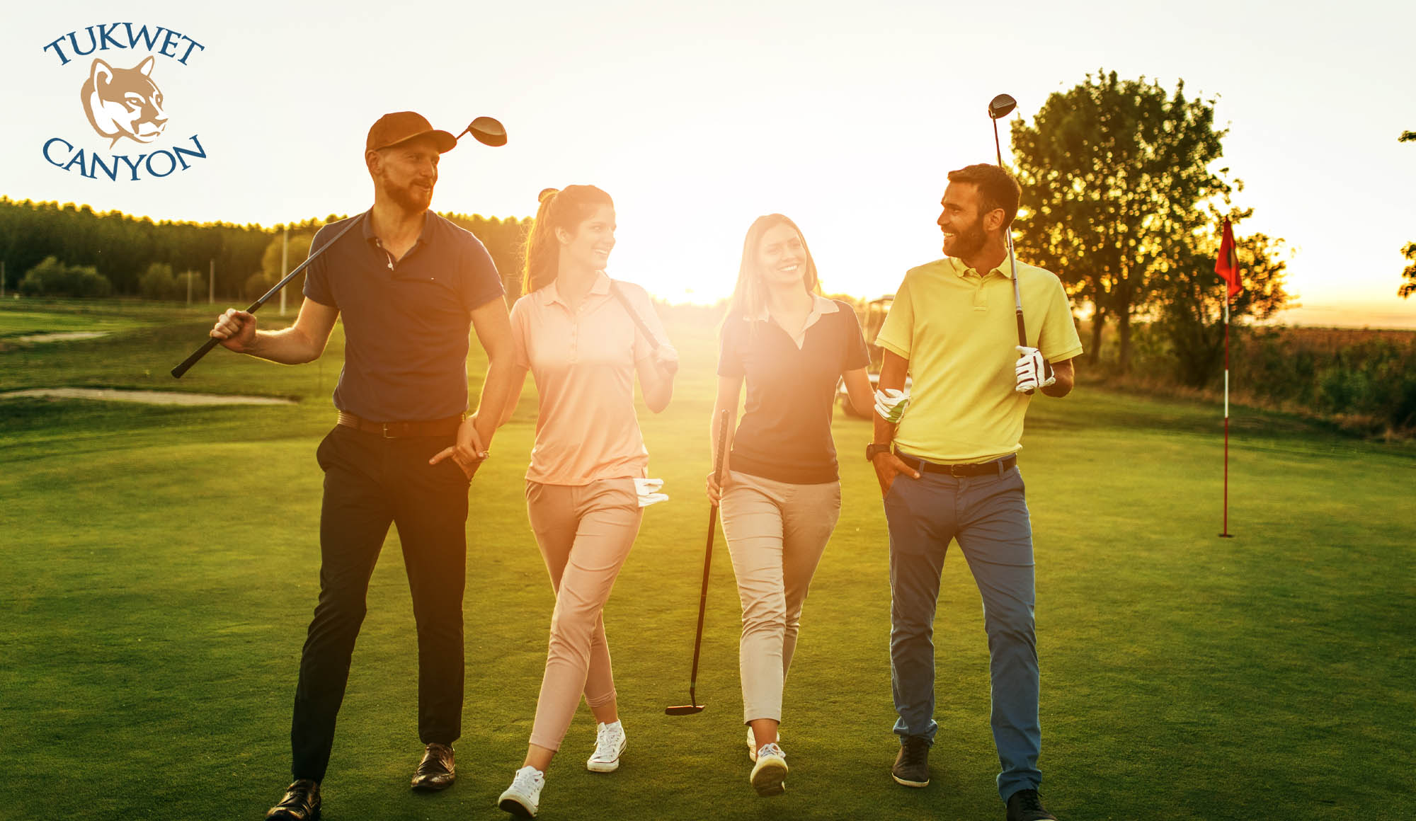 Shot of four people out on a double date on a golf course